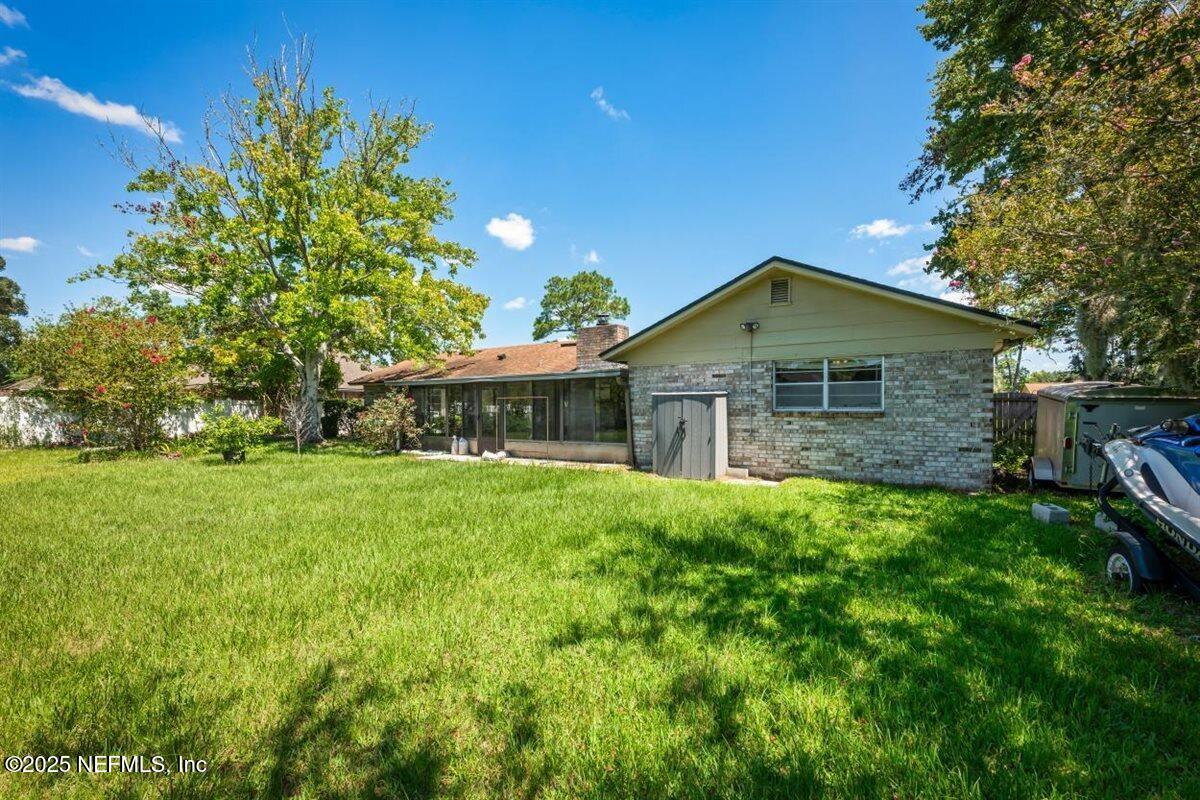 2477 Ridgecrest Avenue Orange Park, FL 32065 - Photo 3 of 28 a front view of a house with a garden