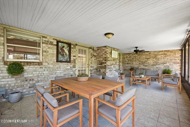 a view of a livingroom with furniture and window