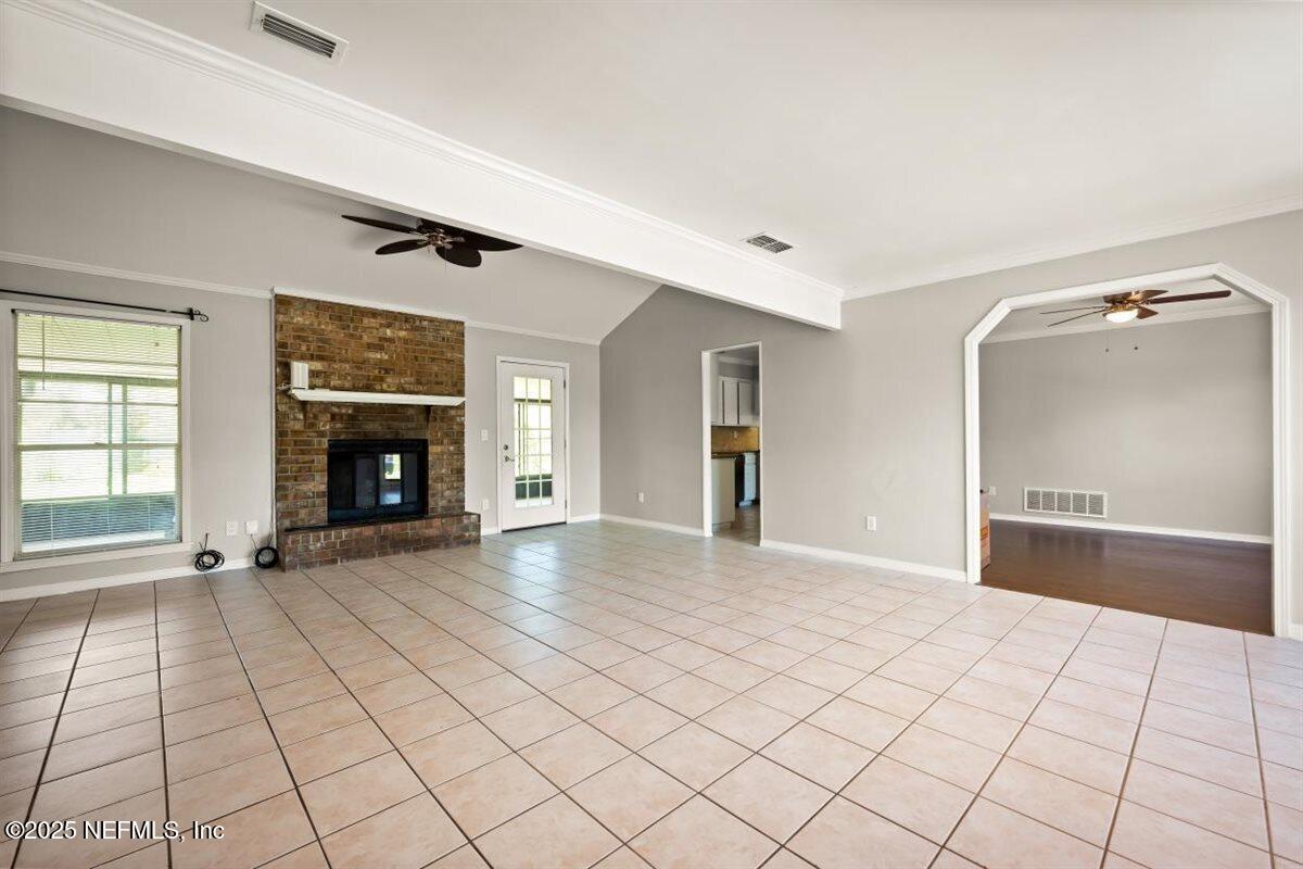 2477 Ridgecrest Avenue Orange Park, FL 32065 - Photo 9 of 28 a view of an empty room and fire place