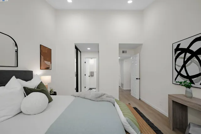 a bedroom with a bed and cabinets