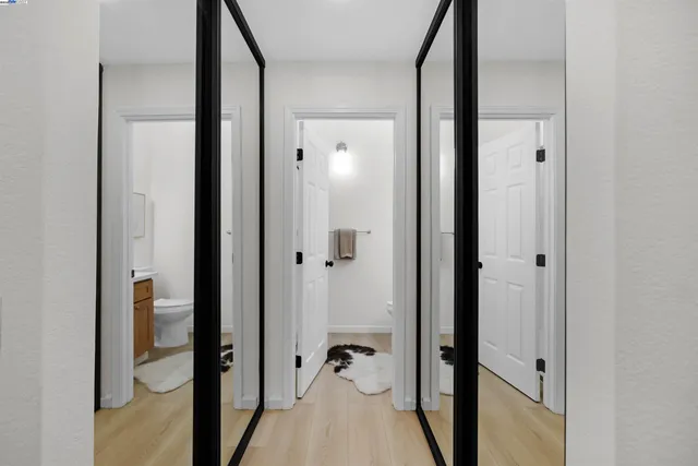 a view of a bathroom from a hallway