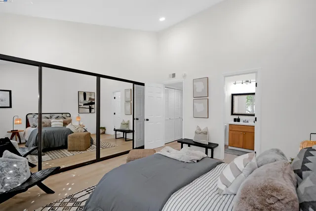 a bedroom with a bed and a couch