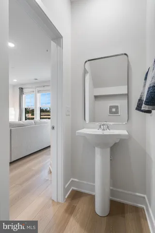 a bathroom with a sink and mirror