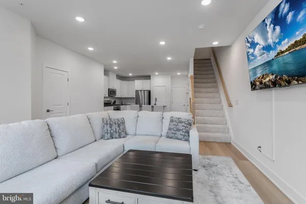 a living room with furniture and a rug