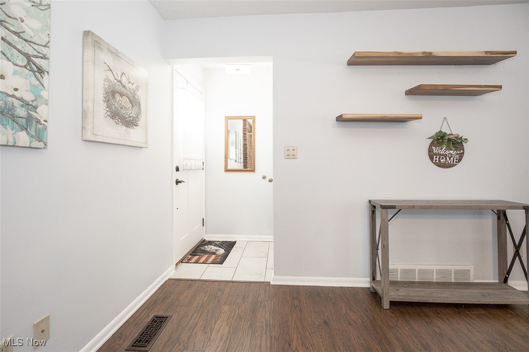 15446 Drake Road Strongsville, OH 44136 - Photo 11 of 42 Entryway featuring wood finished floors and baseboards