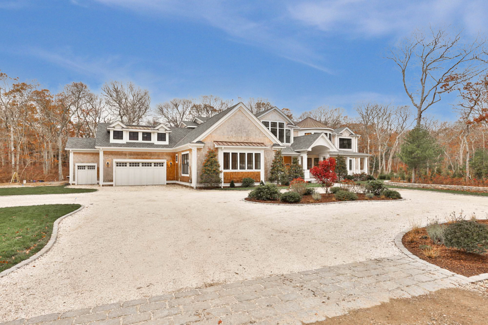 14 Trapps Pond Road Edgartown, MA 02539 - Photo 2 of 34 a front view of a house with a yard