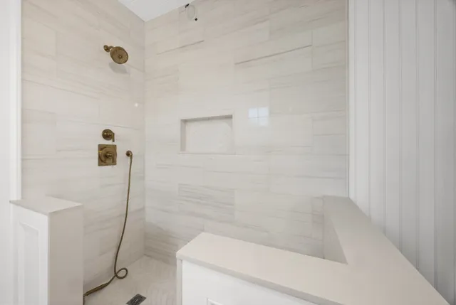 a bathroom with a shower and a toilet