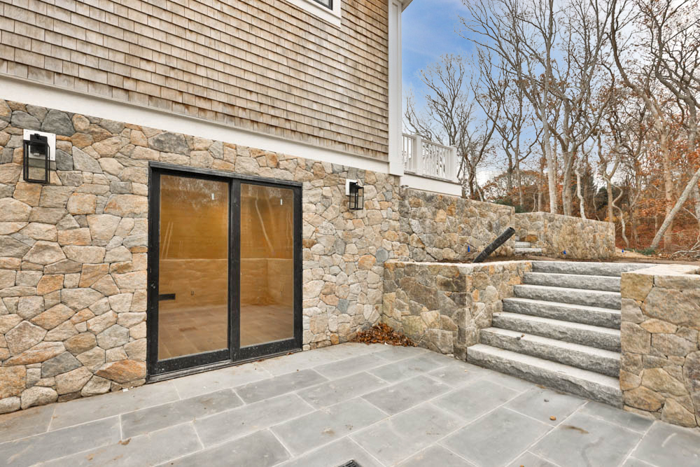 14 Trapps Pond Road Edgartown, MA 02539 - Photo 33 of 34 a view of a house with a door and wooden walls