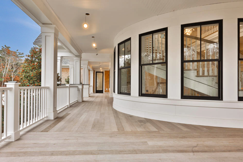 14 Trapps Pond Road Edgartown, MA 02539 - Photo 4 of 34 a view of a hallway with wooden floor and fence