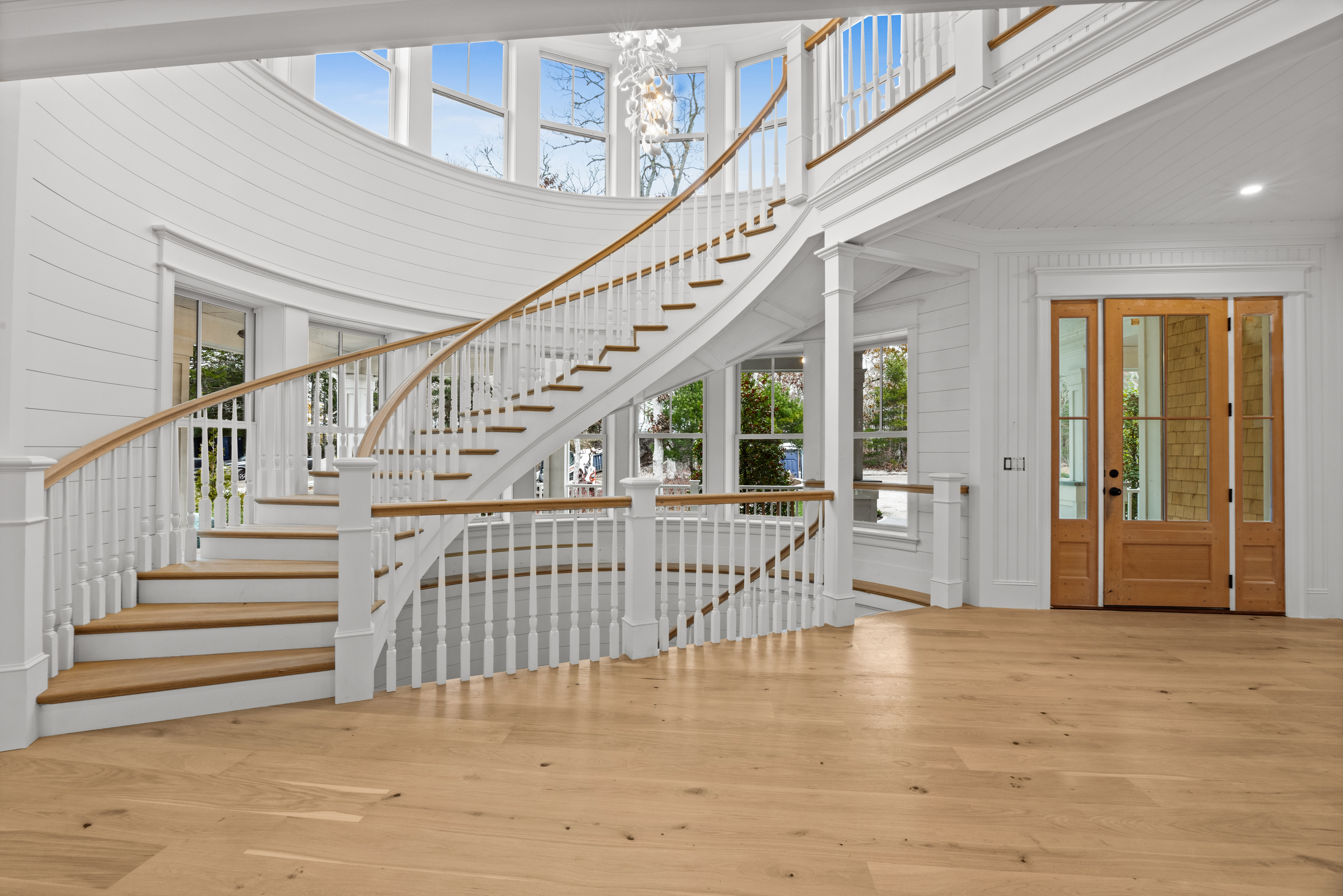 14 Trapps Pond Road Edgartown, MA 02539 - Photo 5 of 34 a view of staircase with lots of frames and a rug