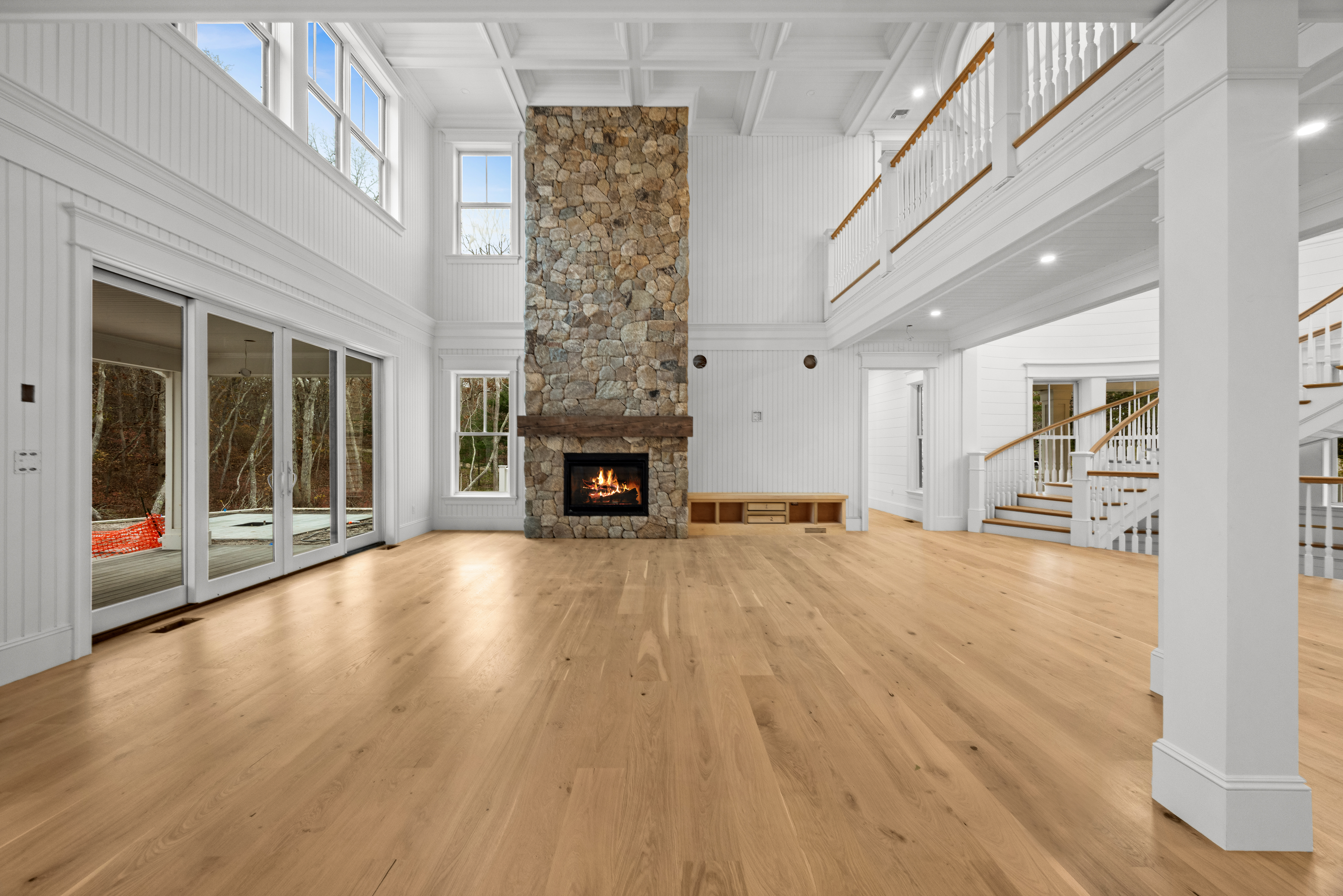 14 Trapps Pond Road Edgartown, MA 02539 - Photo 6 of 34 a view of an empty room with wooden floor and a fireplace