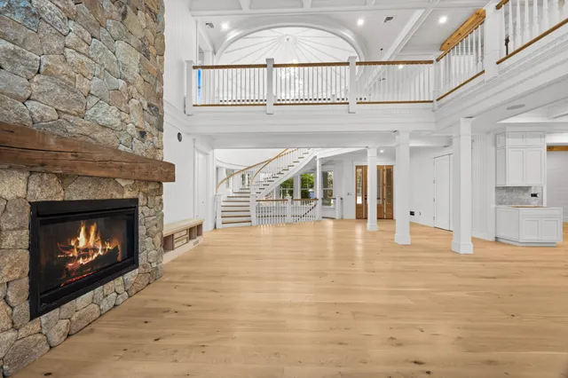 a view of an empty room and fire place