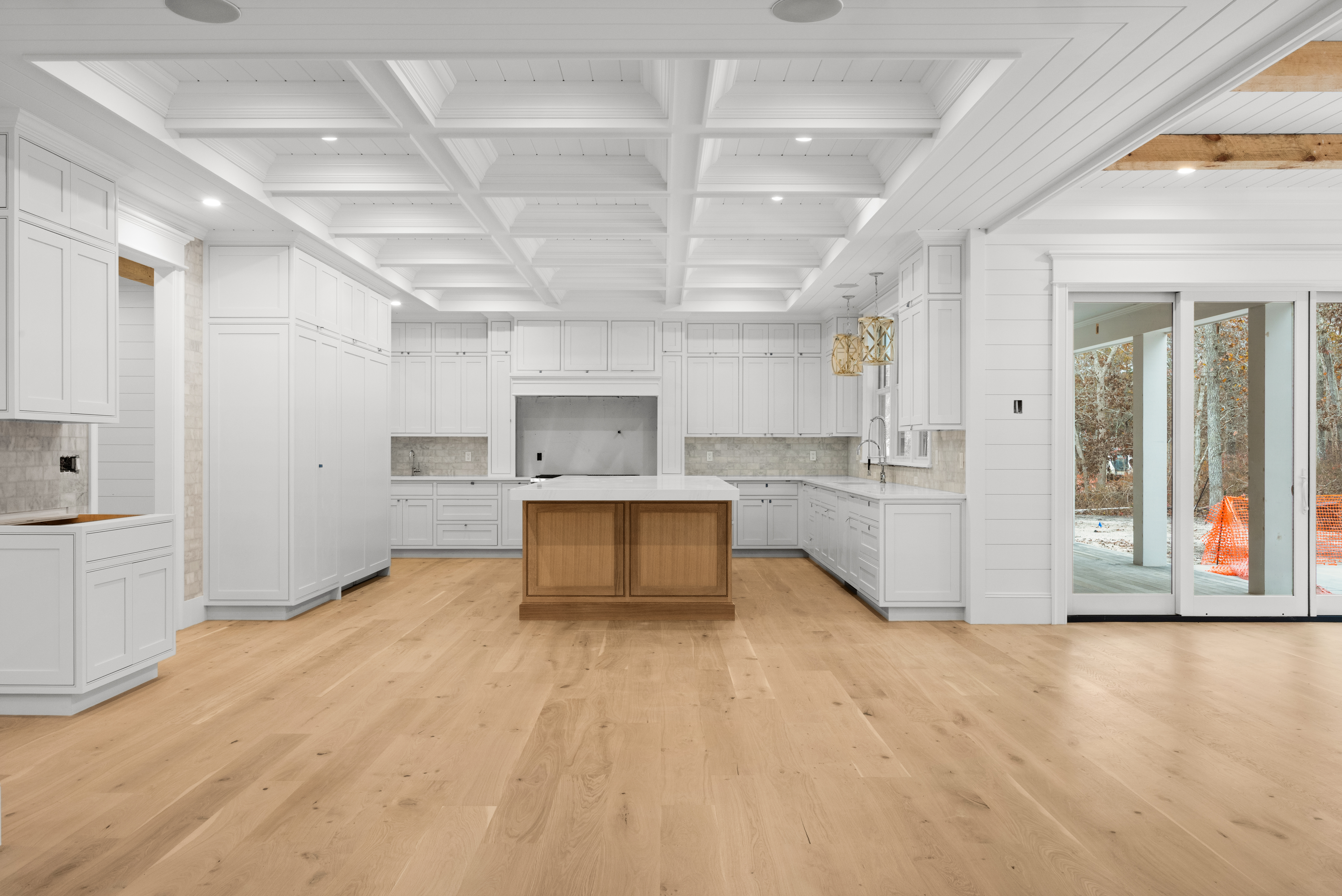14 Trapps Pond Road Edgartown, MA 02539 - Photo 9 of 34 a large white kitchen with kitchen island a stove a sink and a refrigerator