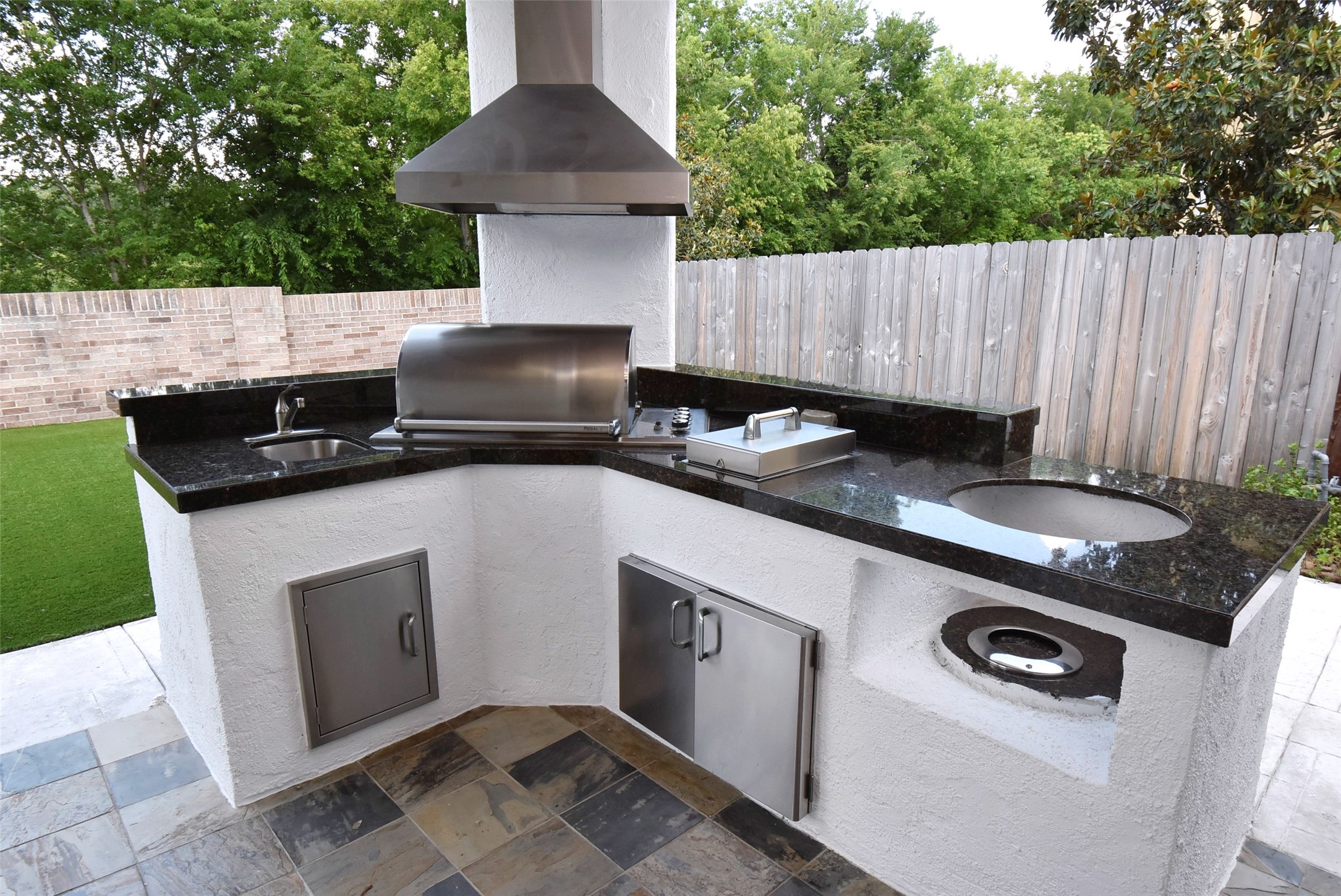 2014 Split Branch Court Houston, TX 77077 - Photo 32 of 47 a kitchen with a stove a sink and a cabinets