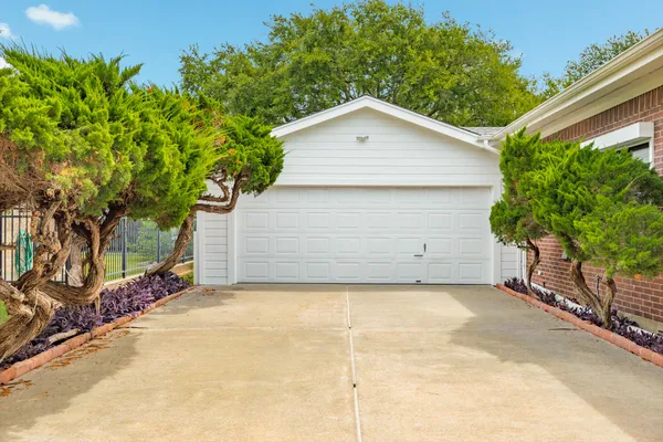 a view of garage and yard