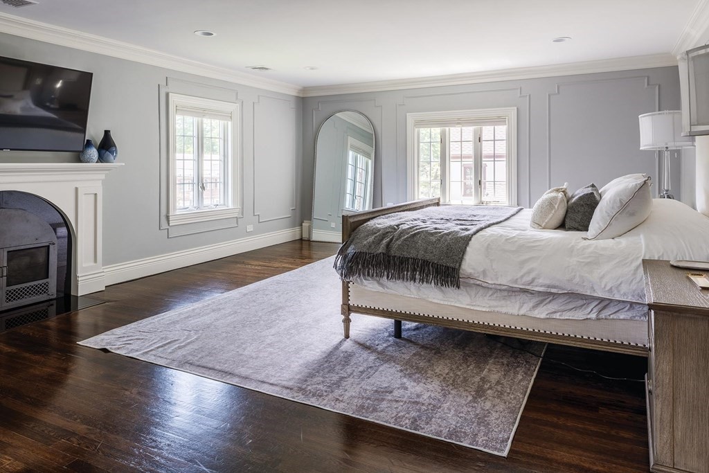 111 Gordon Road Newton, MA 02468 - Photo 11 of 19 a bedroom with a bed and a fireplace