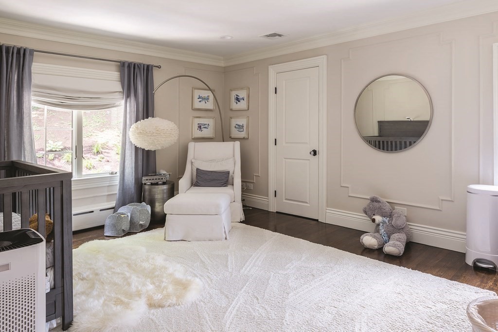 111 Gordon Road Newton, MA 02468 - Photo 14 of 19 a spacious bedroom with a bed a rug and a large window
