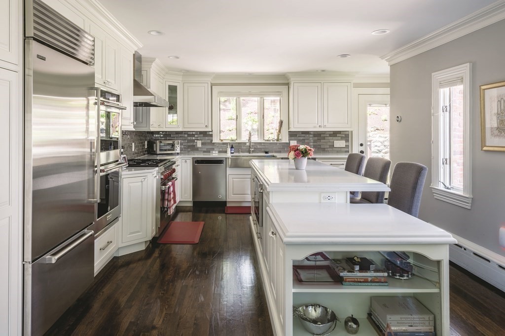 111 Gordon Road Newton, MA 02468 - Photo 6 of 19 a open kitchen with a refrigerator stove top oven and sink