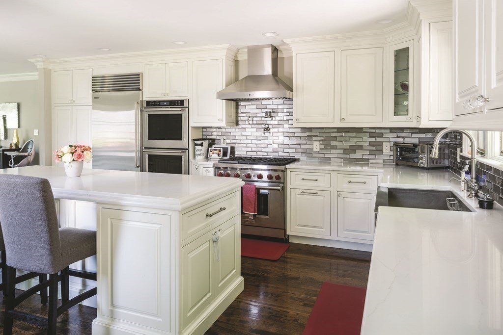 111 Gordon Road Newton, MA 02468 - Photo 7 of 19 a kitchen with kitchen island granite countertop a sink stainless steel appliances and white cabinets