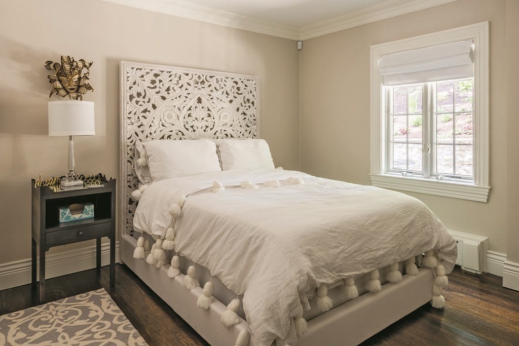 111 Gordon Road Newton, MA 02468 - Photo 10 of 19 a large bed sitting in a bedroom next to a window