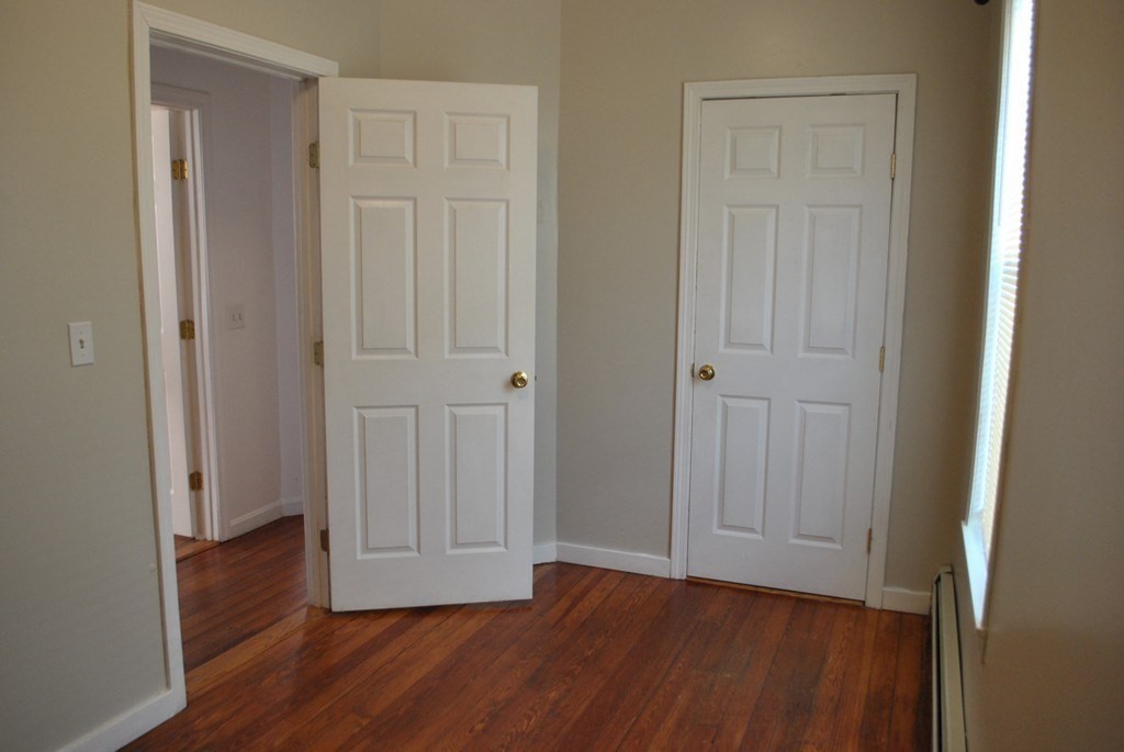 40 I Street, Unit 3 Boston, MA 02127 - Photo 11 of 11 a view of empty room with wooden floor