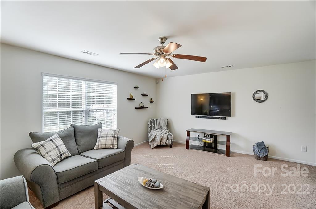4715 McClure Road Charlotte, NC 28216 - Photo 13 of 36 a living room with furniture and a flat screen tv