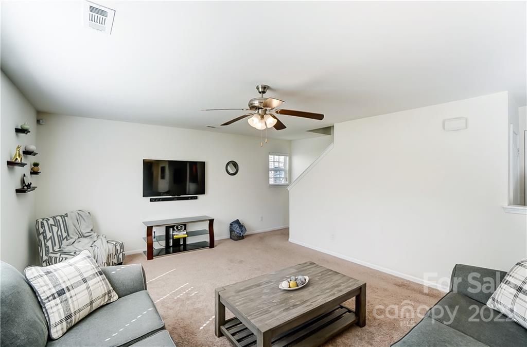 4715 McClure Road Charlotte, NC 28216 - Photo 14 of 36 a living room with furniture and a flat screen tv