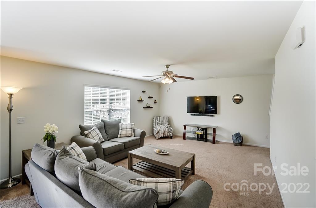 4715 McClure Road Charlotte, NC 28216 - Photo 15 of 36 a living room with furniture and a flat screen tv