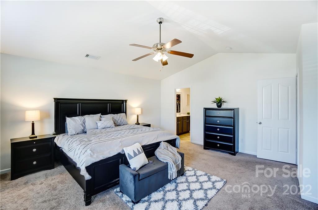 4715 McClure Road Charlotte, NC 28216 - Photo 18 of 36 a bedroom with a bed and dresser