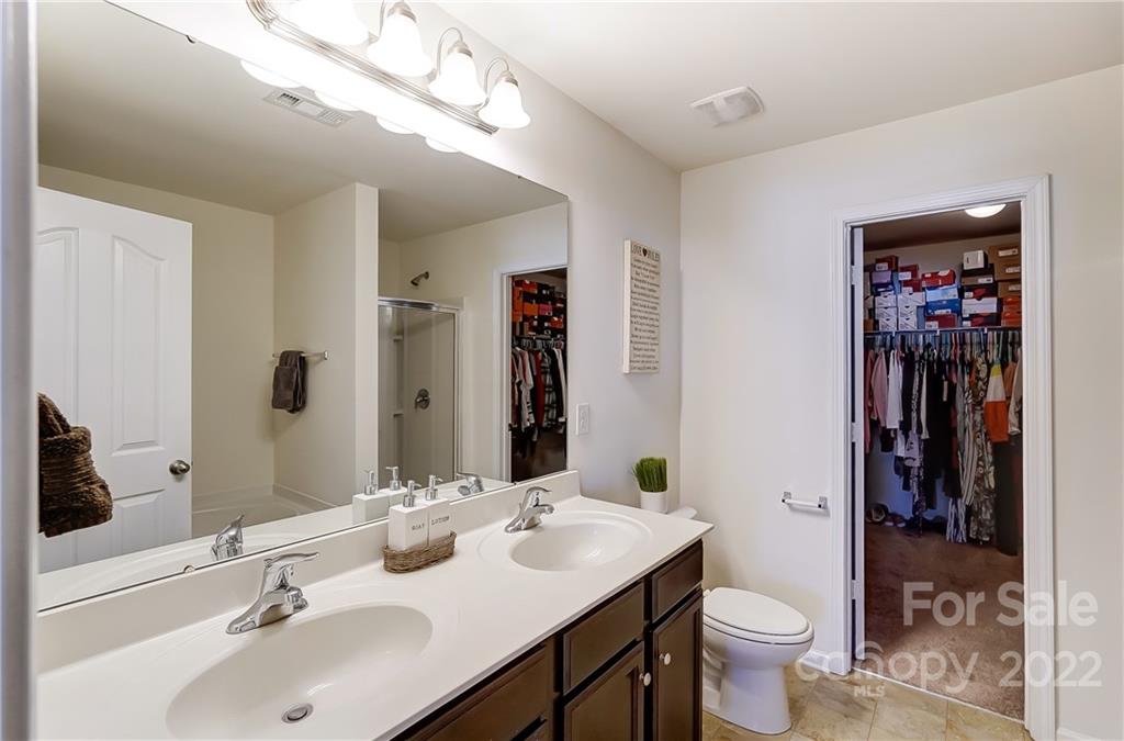 4715 McClure Road Charlotte, NC 28216 - Photo 20 of 36 a bathroom with a toilet sink and mirror