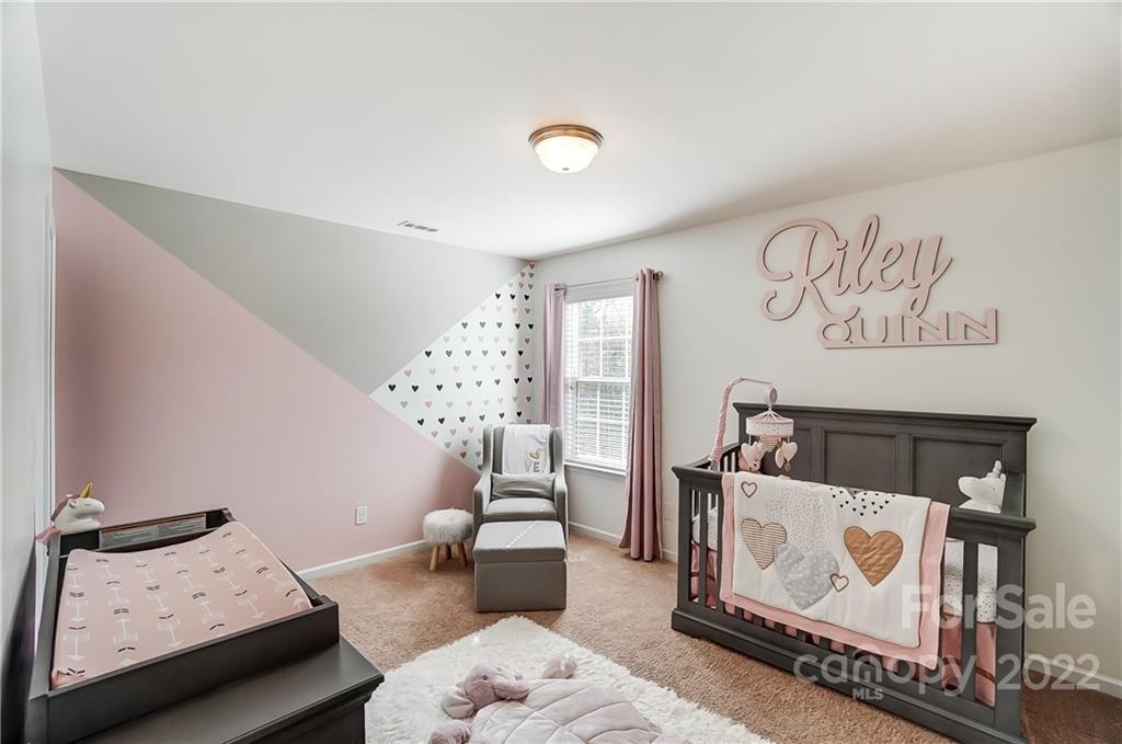 4715 McClure Road Charlotte, NC 28216 - Photo 26 of 36 a bedroom with furniture and a couch