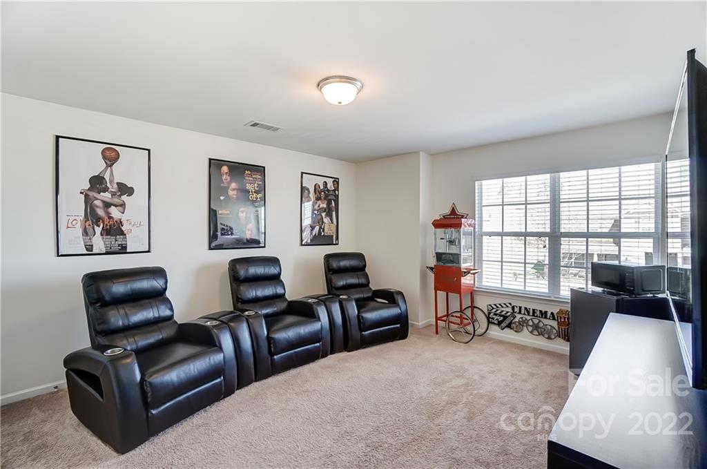 4715 McClure Road Charlotte, NC 28216 - Photo 30 of 36 a living room with furniture and a flat screen tv