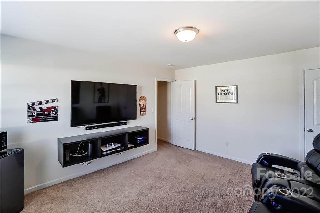 4715 McClure Road Charlotte, NC 28216 - Photo 31 of 36 a living room with furniture and a flat screen tv