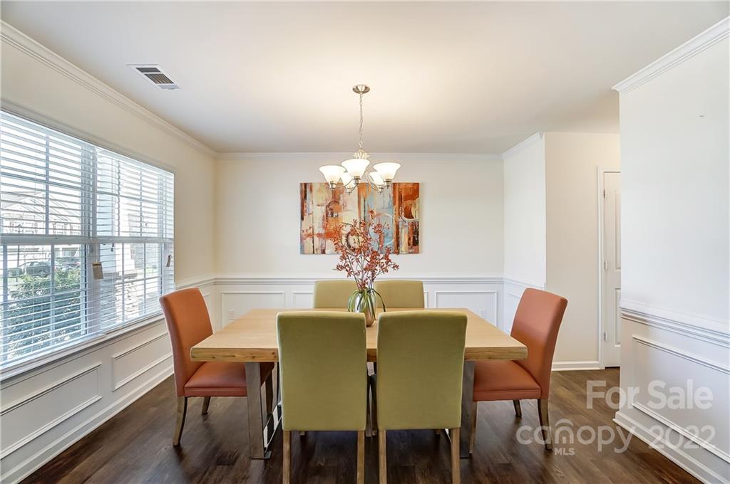4715 McClure Road Charlotte, NC 28216 - Photo 6 of 36 a view of a dining room with furniture window and outside view