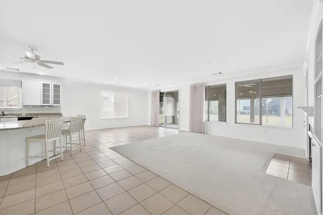 a view of a livingroom with furniture and chandelier