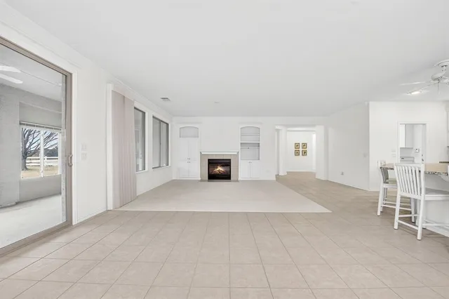 a big room with closet and a fireplace