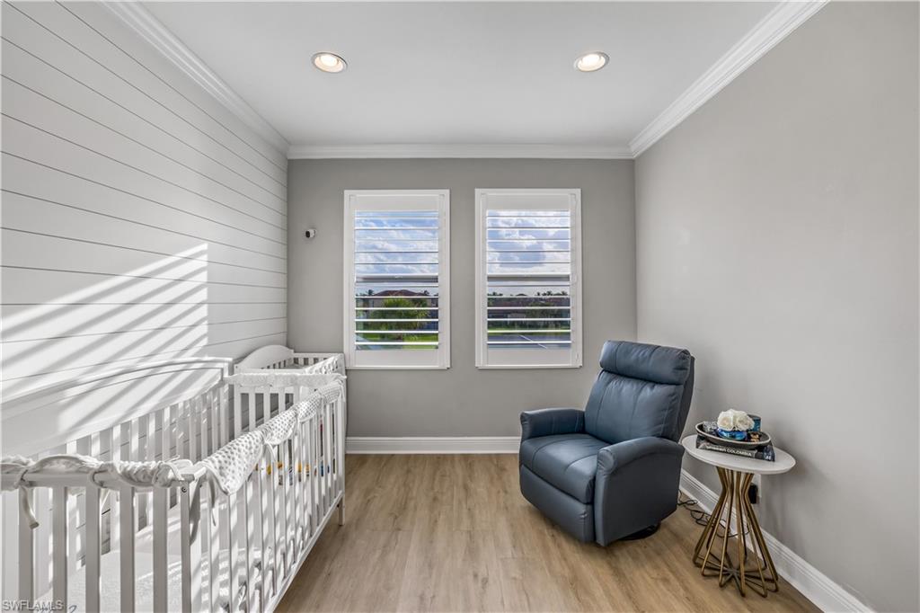 4605 Abaca Circle Naples, FL 34119 - Photo 14 of 35 a bedroom with furniture and a window