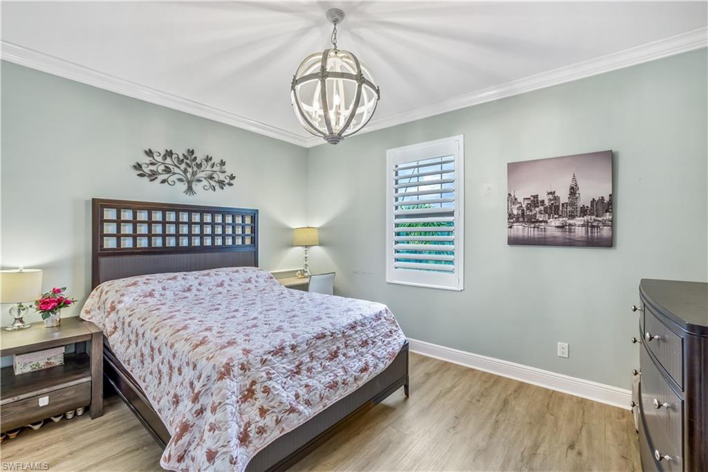 4605 Abaca Circle Naples, FL 34119 - Photo 21 of 35 a bedroom with a bed and a window