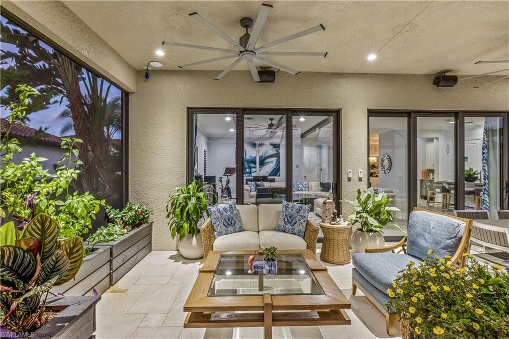 4605 Abaca Circle Naples, FL 34119 - Photo 26 of 35 a living room with furniture and a potted plant