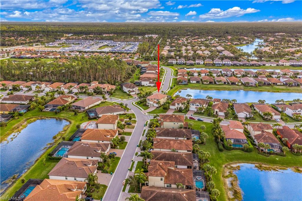 4605 Abaca Circle Naples, FL 34119 - Photo 28 of 35 a view of a city with mountains in the background