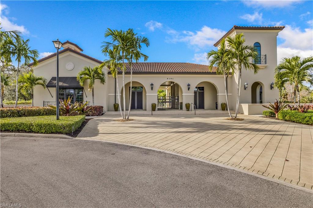 4605 Abaca Circle Naples, FL 34119 - Photo 30 of 35 a view of a white house with a large windows and plants
