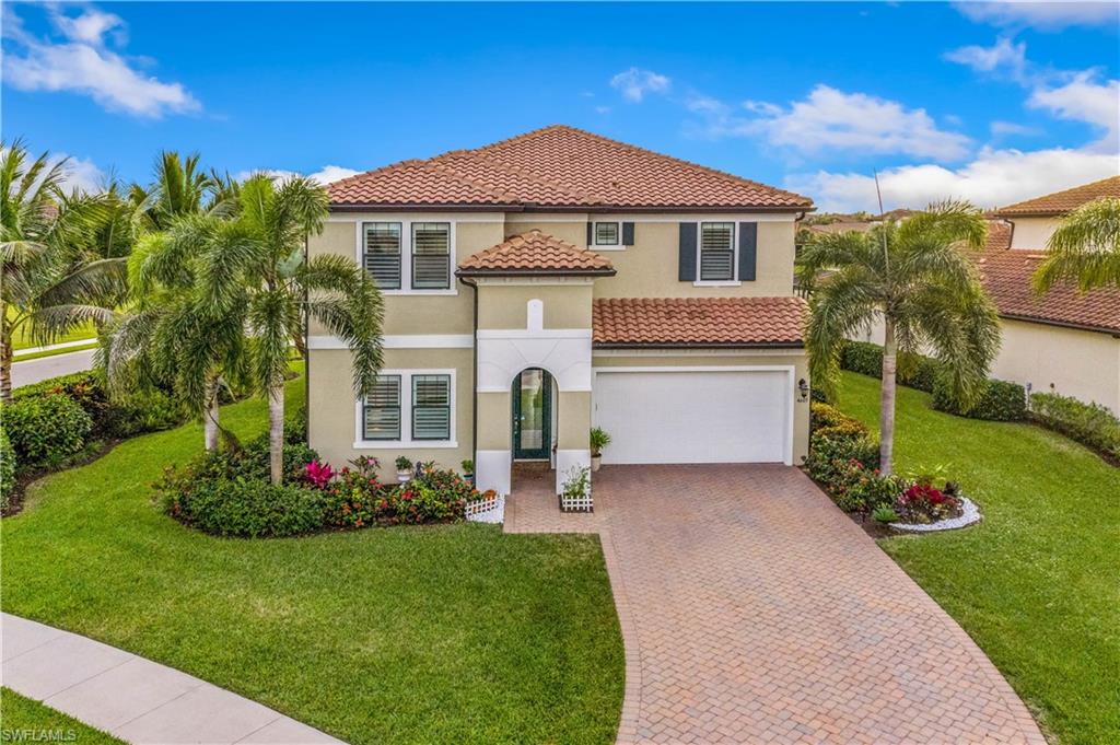 4605 Abaca Circle Naples, FL 34119 - Photo 35 of 35 a front view of a house with a garden