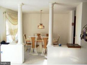 196 Torpedo Road Manahawkin, NJ 08050 - Photo 4 of 6 a dining room with furniture and a floor to ceiling window