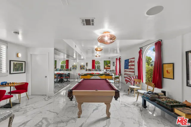 a room with musical instruments and air hockey table