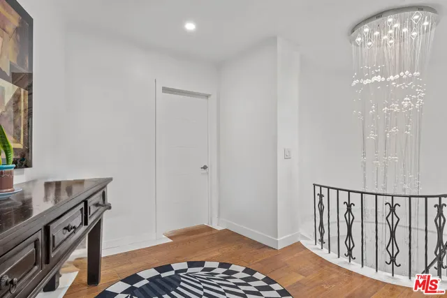 a view of entryway with wooden floor