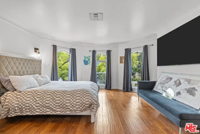 a bedroom with a bed and window