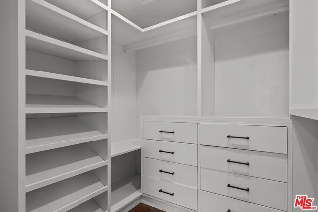 a view of an empty walk in closet