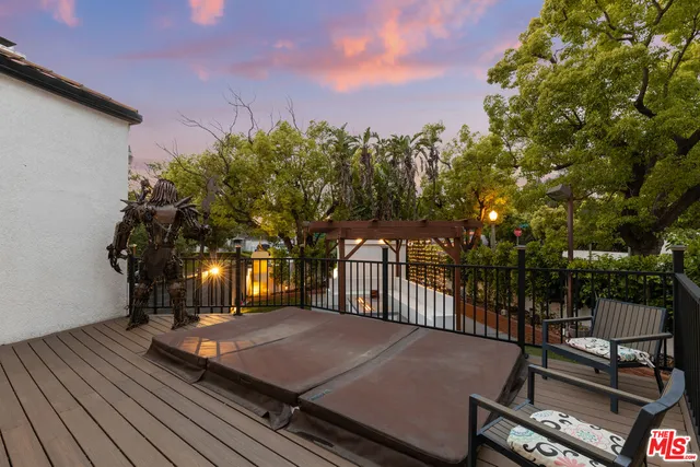 a view of a backyard with sitting area