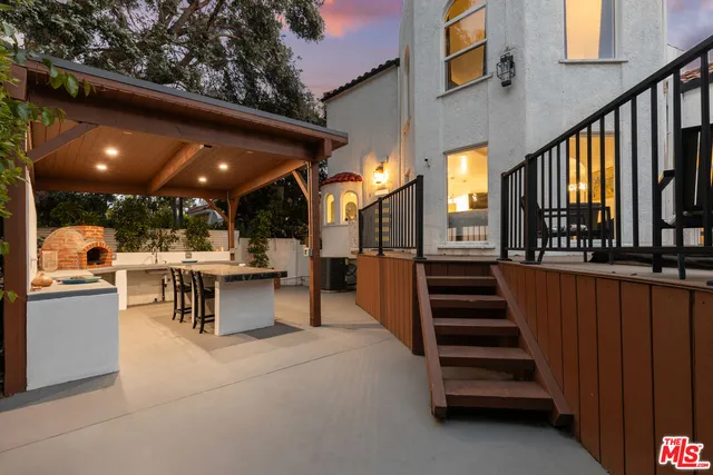 a view of a patio with table and chairs