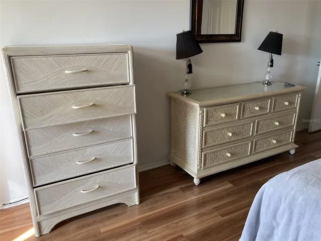 a kitchen with a cabinets and a wooden floor